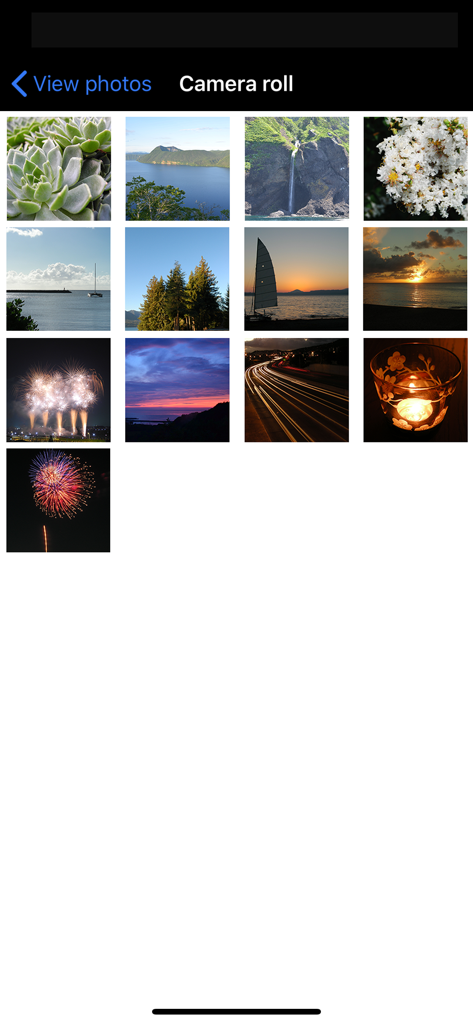 A grid view of high-quality landscape and macro photos inside the Nikon Wireless Mobile Utility app camera roll.