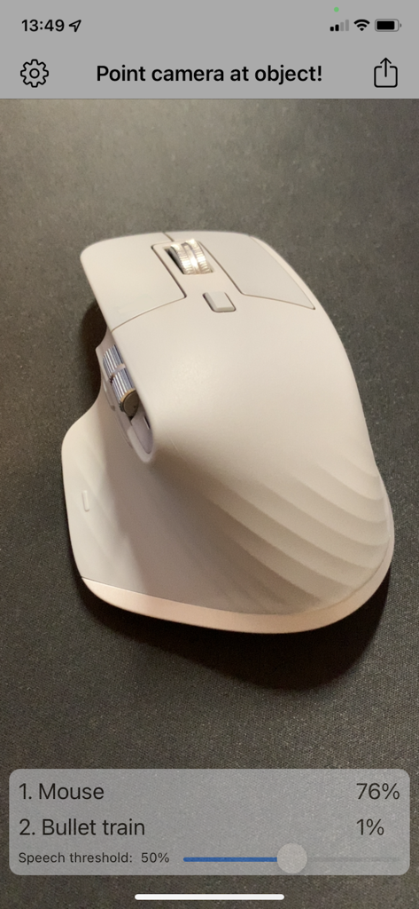 AI-Camera app interface detecting a white computer mouse with 76 percent confidence