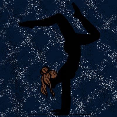 a woman doing a handstand