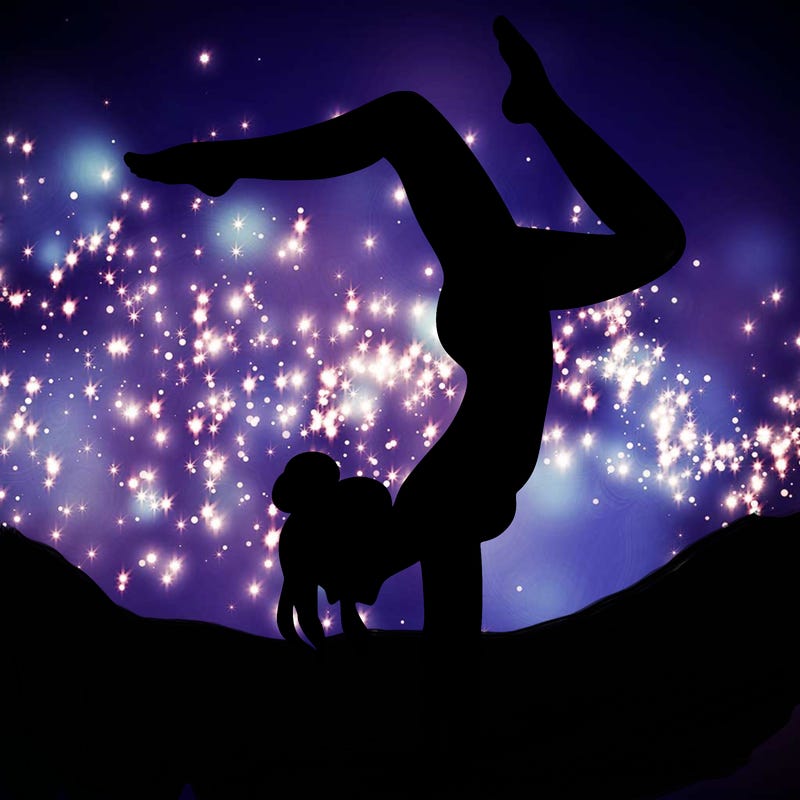 a woman doing a handstand