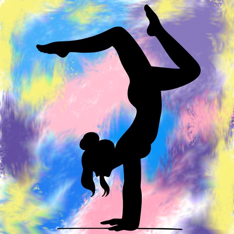 a woman doing a handstand