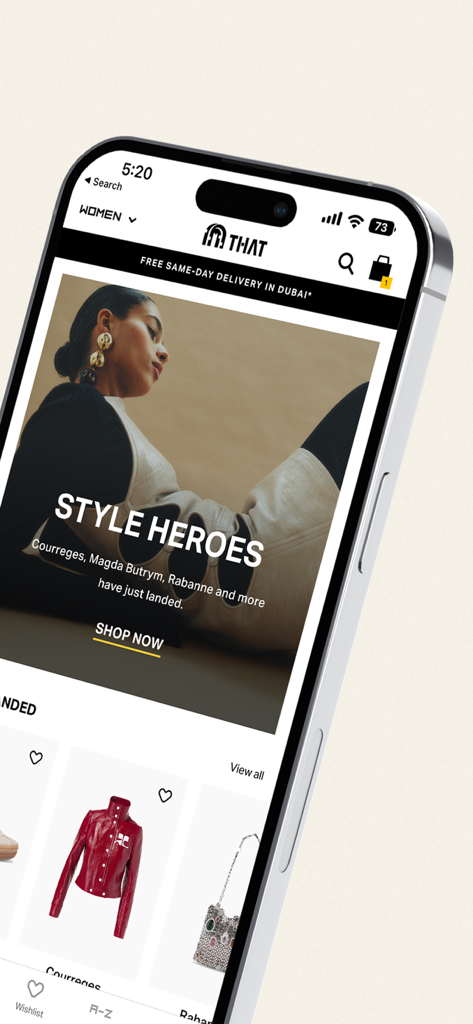 THAT Concept Store - Shopping - Un telefono cellulare che visualizza l'app di shopping THAT Concept Store con marchi di moda di lusso e la sezione degli eroi dello stile