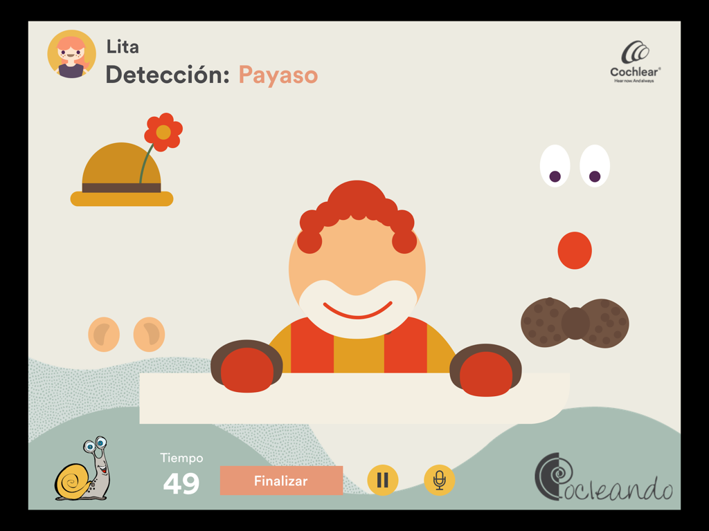 Interfaz de la aplicación Cocleando que muestra un ejercicio de detección auditiva con temática de payaso para terapia pediátrica.