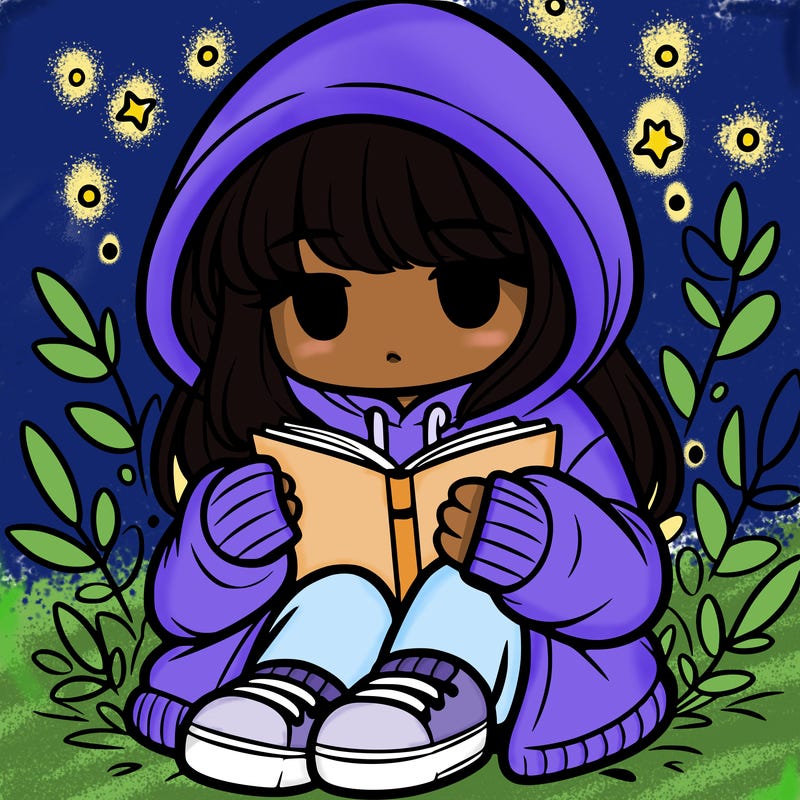 girl in oversized hoodie reading a book