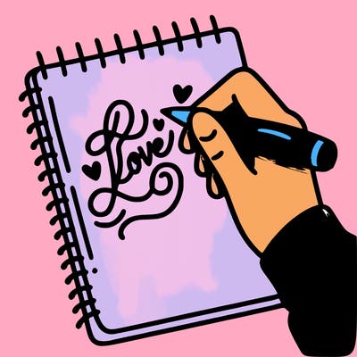 a hand writing “love” in calligraphy on a notebook