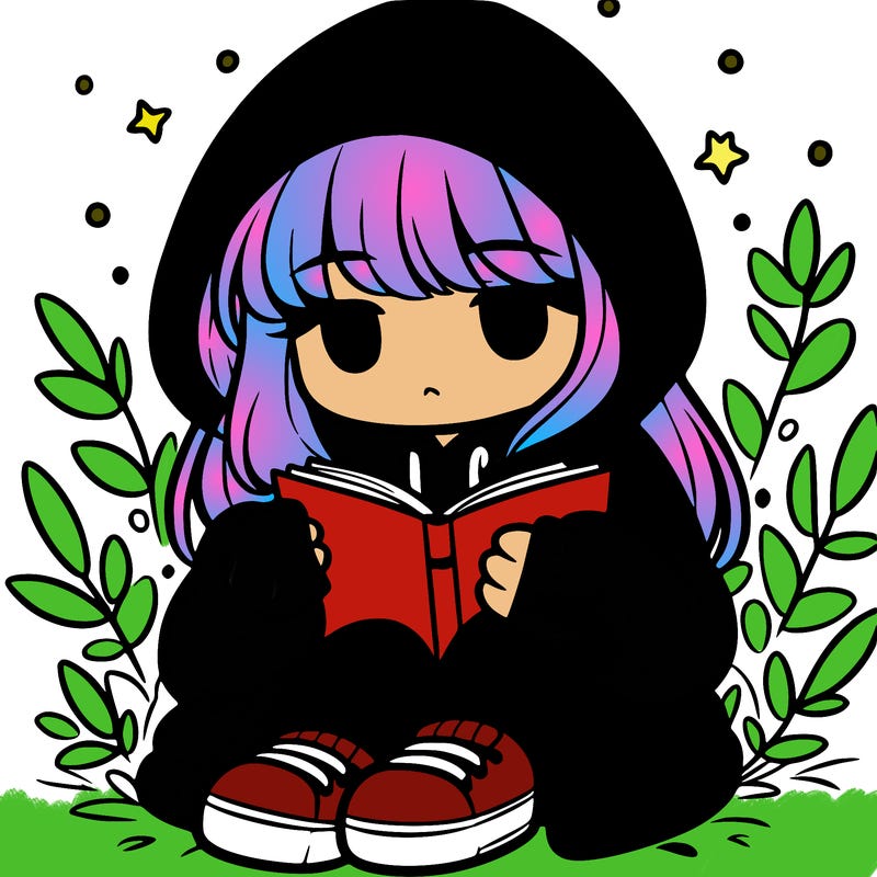girl in oversized hoodie reading a book