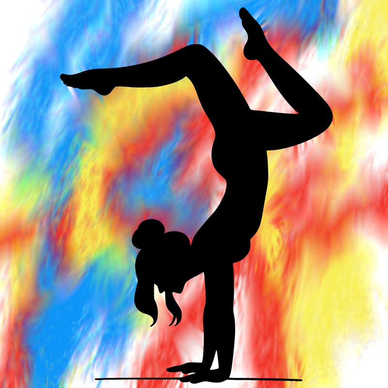 a woman doing a handstand