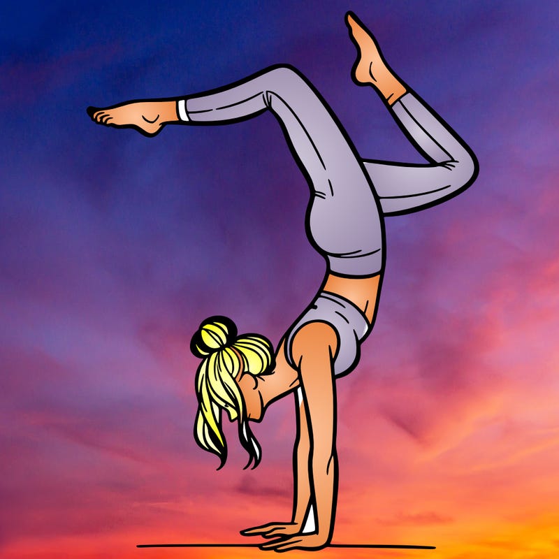 a woman doing a handstand