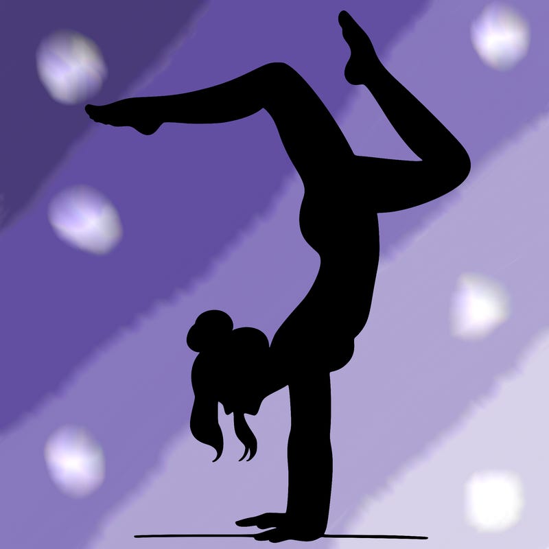 a woman doing a handstand
