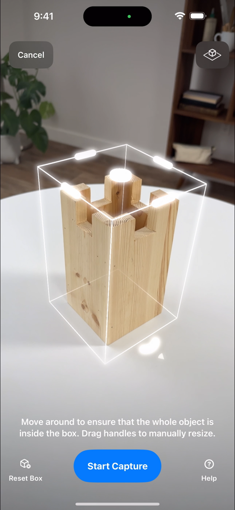Reality Composer interface showing a wooden block within an AR bounding box for 3D scanning