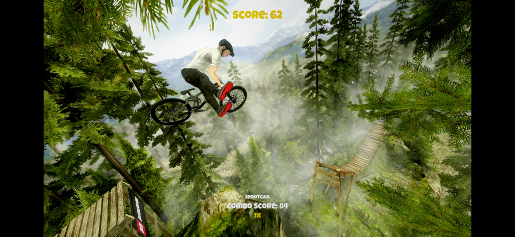 Shred! 2 - ft Sam Pilgrim 2023 - Un mountain biker esegue un trick 2footcan a mezz'aria sopra un sentiero forestale in Shred 2.