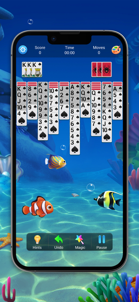 Spider Solitaire card game interface with an underwater ocean background and tropical fish