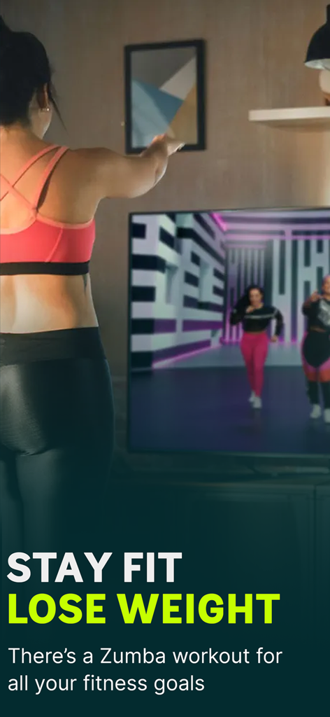 A woman practicing a Zumba dance workout at home following instructors on a TV screen