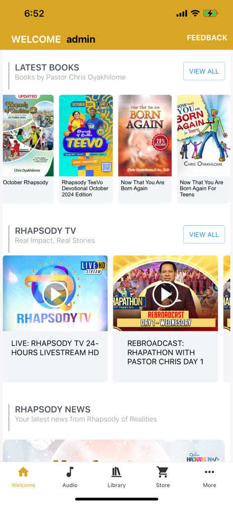 Pantalla de inicio de la aplicación Rhapsody of Realities mostrando las últimas novedades de libros y secciones de Rhapsody TV.