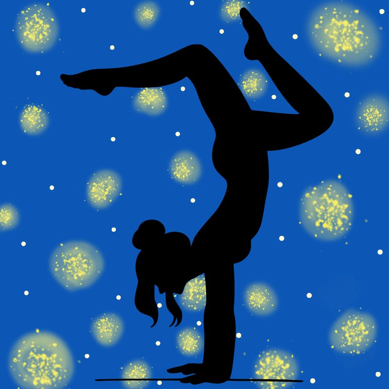 a woman doing a handstand