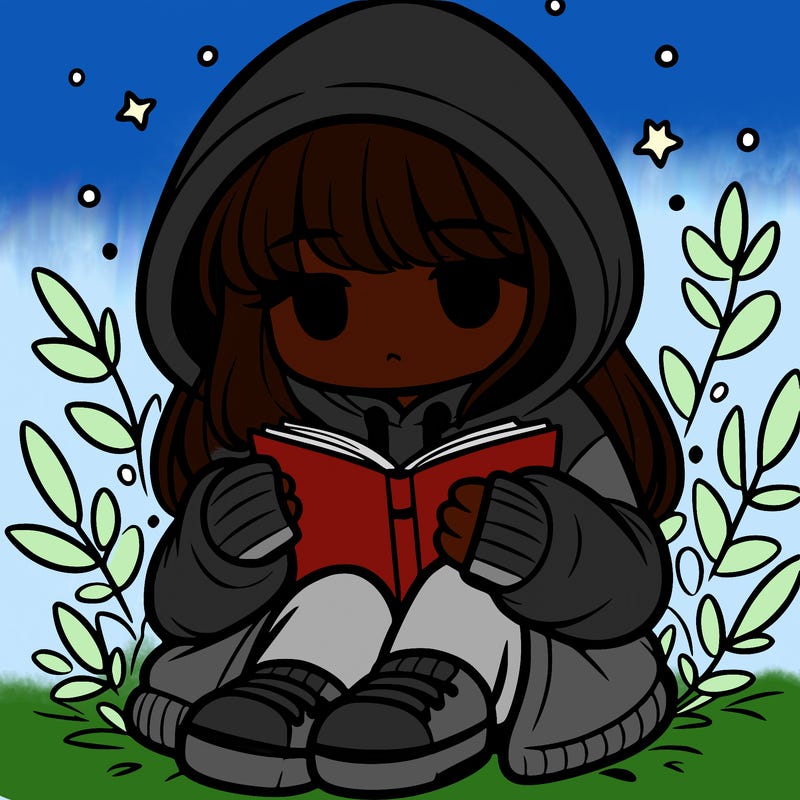 girl in oversized hoodie reading a book