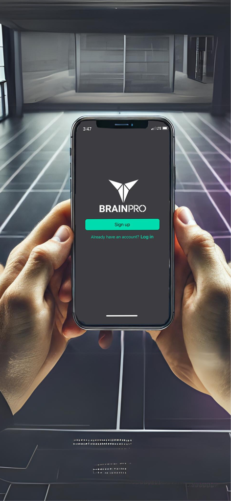 Brainpro Eye Training - A person holding a smartphone displaying the Brainpro Eye Training sign up screen in a professional training environment