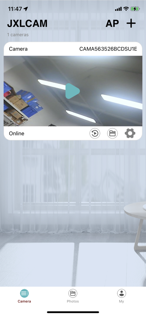 JXLCAM 网络视频监控系统 - JXLCAM app main screen displaying a live camera feed from a home security camera with options for playback and settings