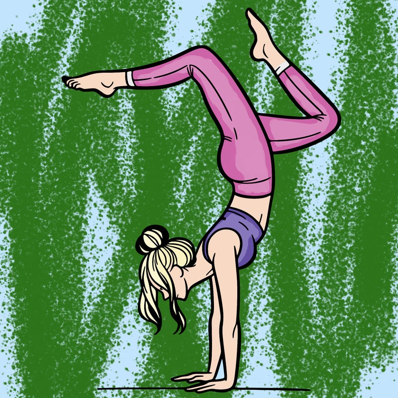 a woman doing a handstand
