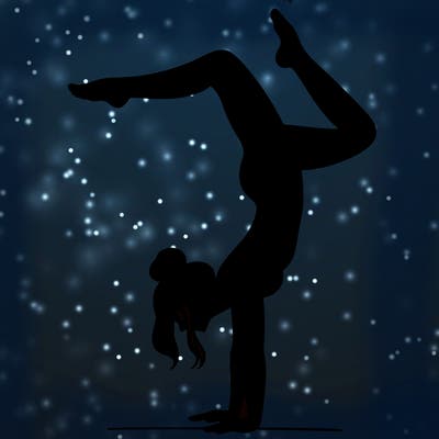 a woman doing a handstand