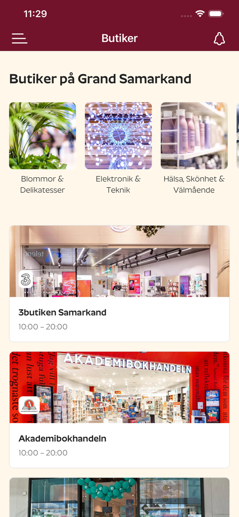 Grand Plus - Vista del directorio de tiendas en la aplicación de fidelización Grand Plus que muestra categorías y horarios de apertura para el centro comercial Grand Samarkand