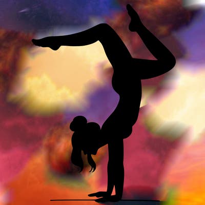 a woman doing a handstand