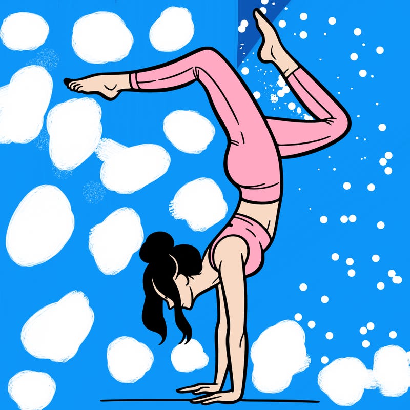 a woman doing a handstand