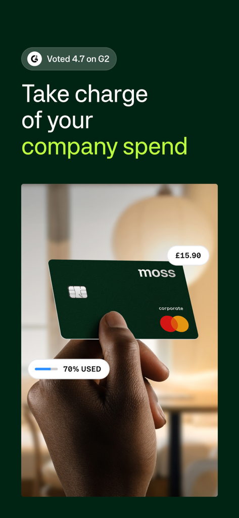 A hand holding a dark green Moss corporate credit card with spending indicators and a 4.7 rating on G2.