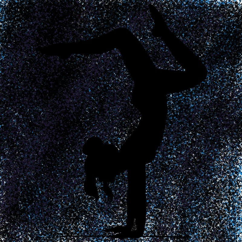 a woman doing a handstand
