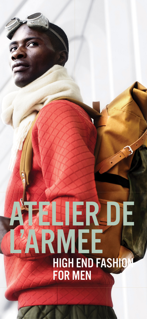 Lifestyle For Men Magazine - A stylish man in a red sweater and yellow backpack showcasing high end men's fashion