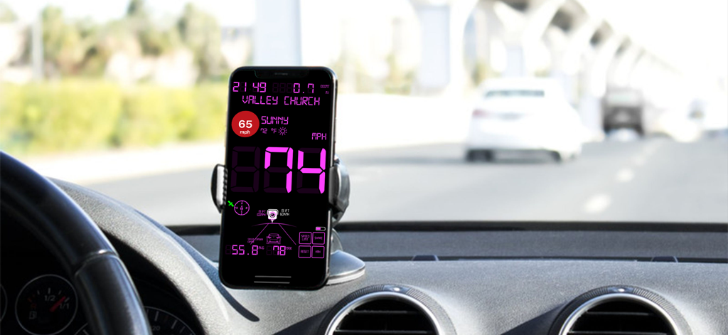 Digital speedometer app on a smartphone mounted on a car dashboard showing speed and weather