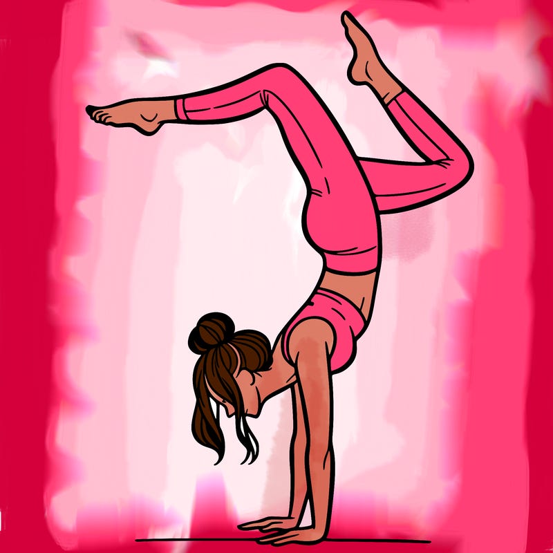 a woman doing a handstand
