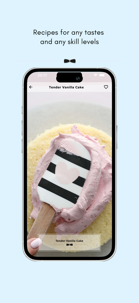 Baking app screen showing a Tender Vanilla Cake being decorated with pink frosting using a heart spatula