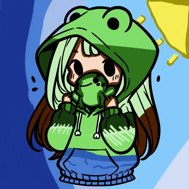 a girl holding a froggy hoodie