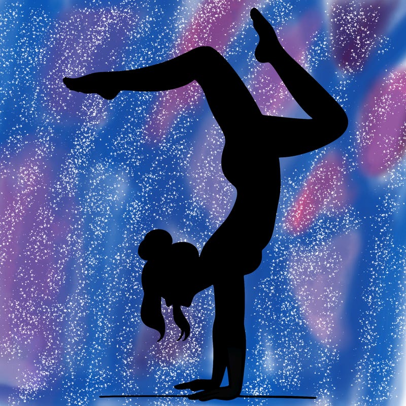 a woman doing a handstand