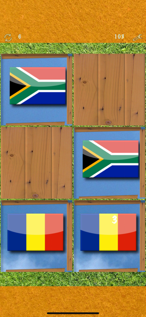 Pairs (Oh no! Another one!) - A memory matching game board featuring national flags on wooden cards.