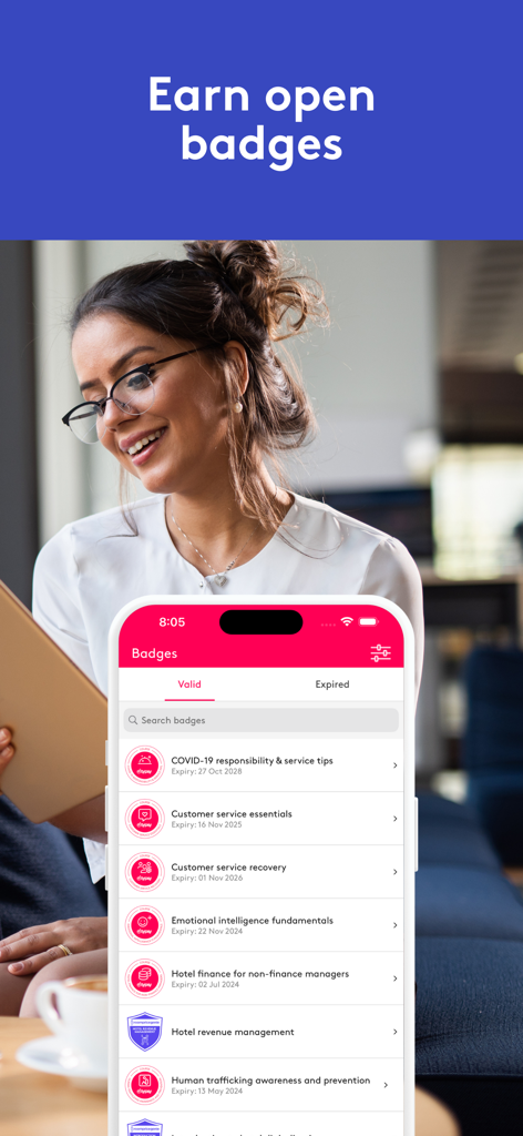 Typsy Mobile - A woman smiling while viewing her hospitality training digital badges on the Typsy app