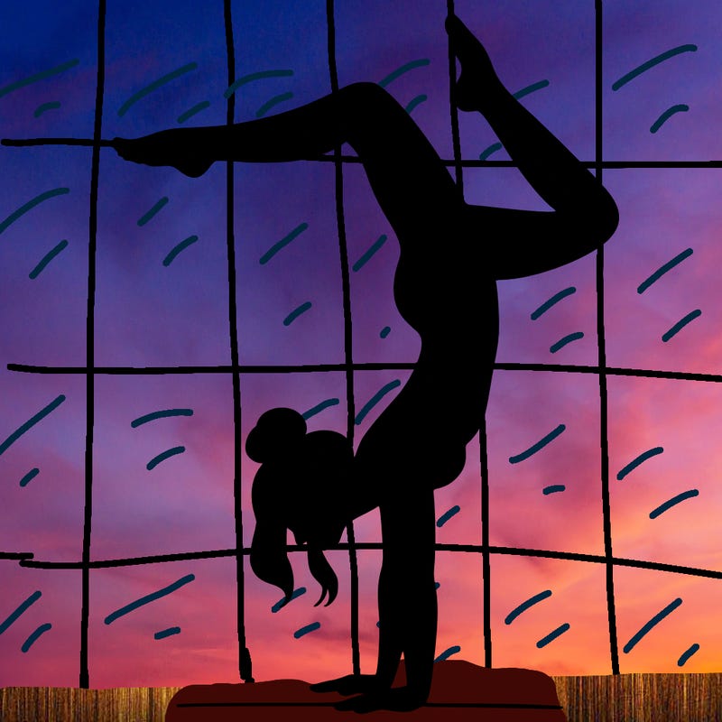 a woman doing a handstand