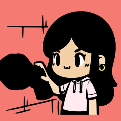 girl spray painting a wall