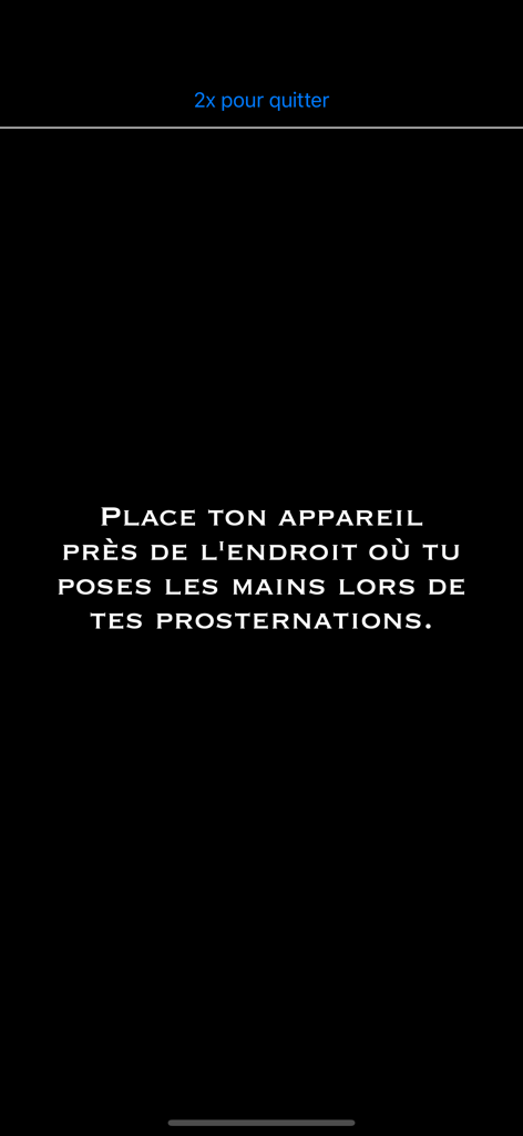 French instruction screen for device placement during prostrations in the Aide a la priere app