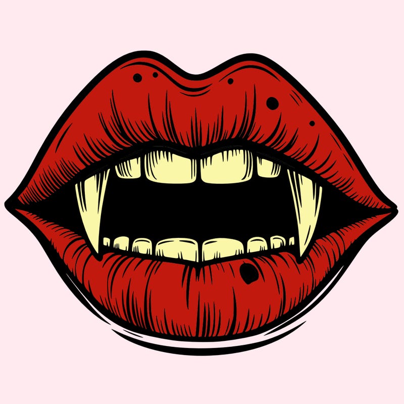 lips with vampire teeth