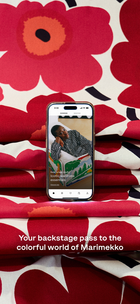 Marimekko | Fashion & Design - An iPhone displaying the Marimekko app screen against a vibrant red floral Unikko print background with the text Your backstage pass to the colorful world of Marimekko.