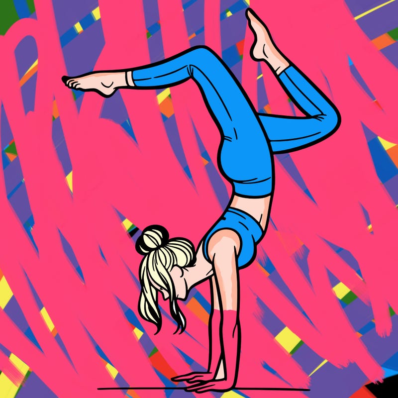 a woman doing a handstand