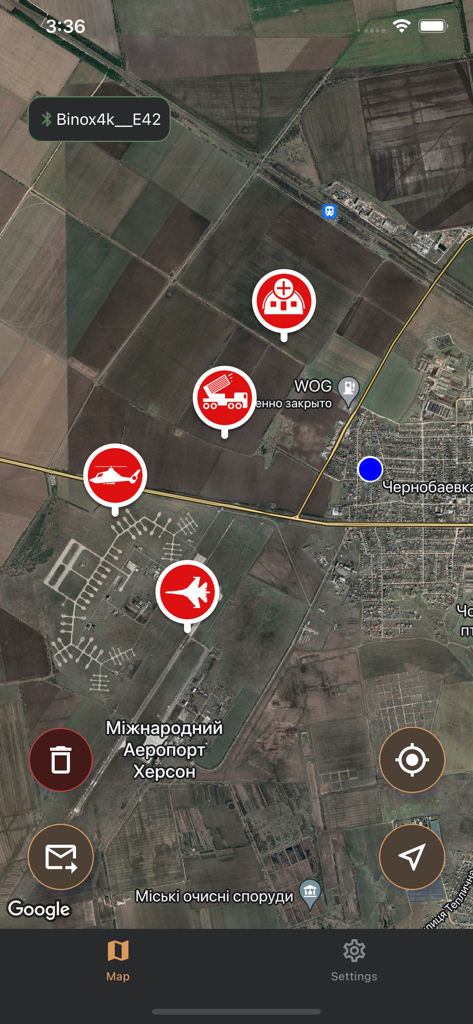 Satellite map interface of the Tactical Map app displaying military markers for aircraft and artillery over a terrain map.