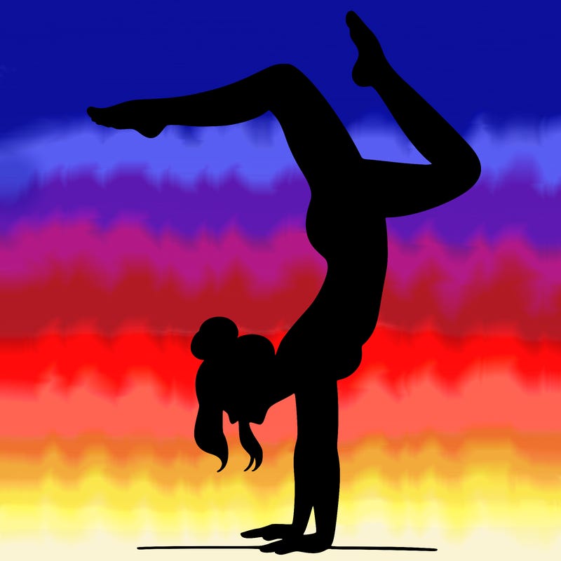 a woman doing a handstand