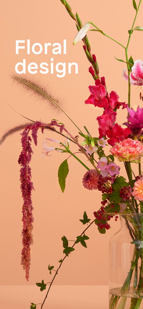 Modern floral design arrangement with vibrant seasonal flowers in a glass vase