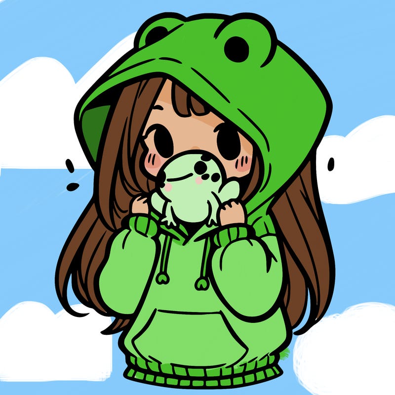 a girl holding a froggy hoodie