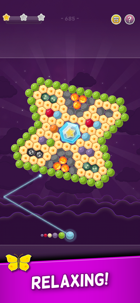 Gameplay of Bubble Cloud Spinning Match-3 showing a hexagonal bubble puzzle.