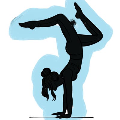 a woman doing a handstand