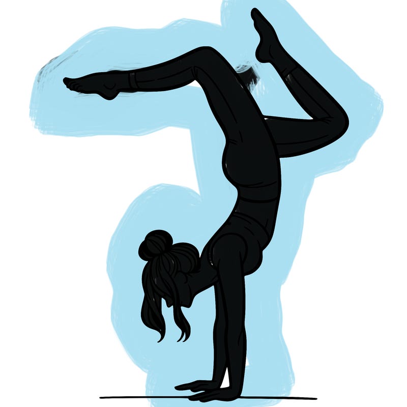 a woman doing a handstand
